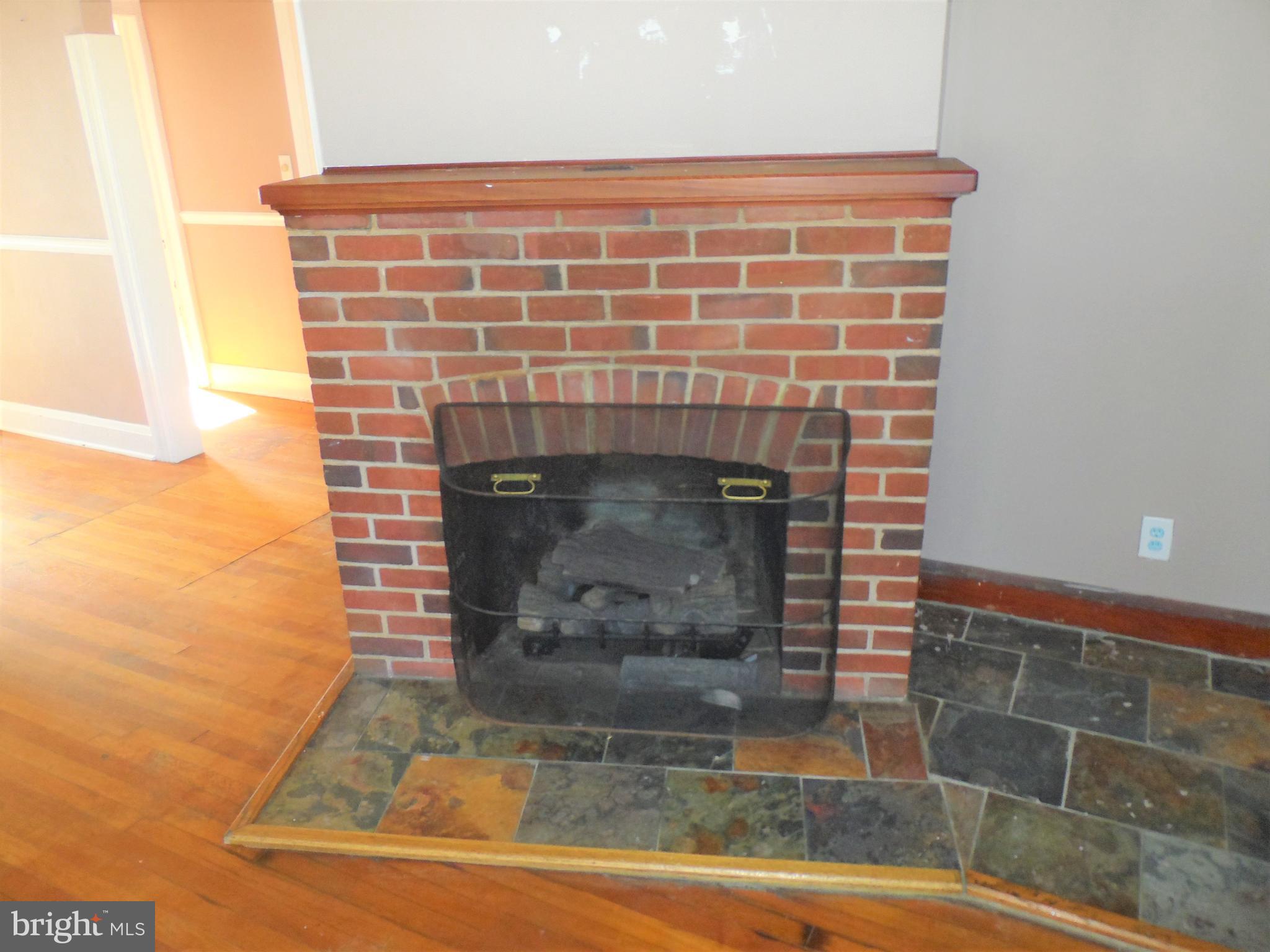 2211 Sparrows Point Road Baltimore, MD 21219 - Photo 17 of 28 a view of fireplace and window