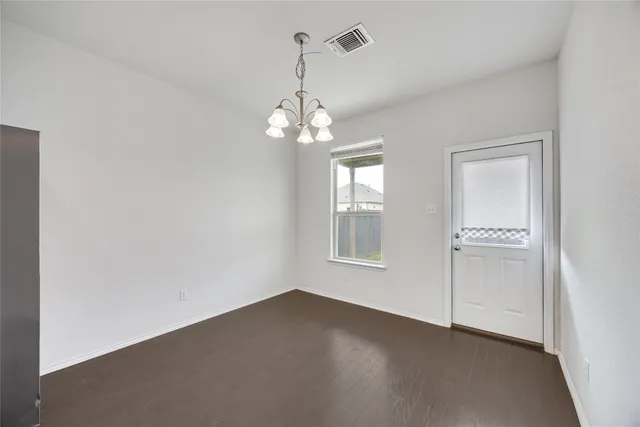 a view of a kitchen with a sink stainless steel appliances and cabinets