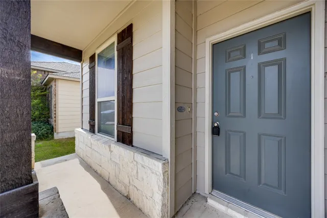 a view of a brick house wth front door