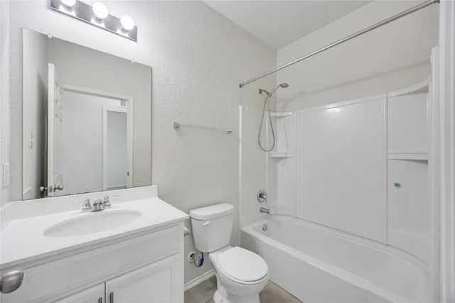 a bathroom with a sink toilet tub and shower