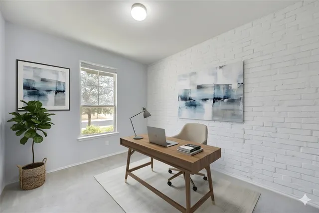 a room with a table and a potted plant