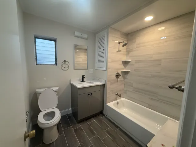 a bathroom with a toilet sink and bathtub