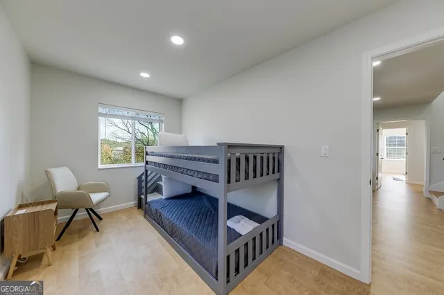 a bedroom with a bed and a couch