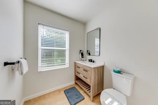 a bathroom with a glass shower door