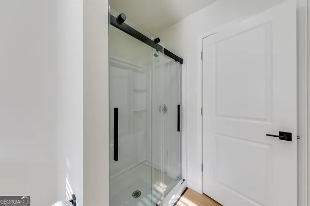 a bedroom with a large bed and a couch