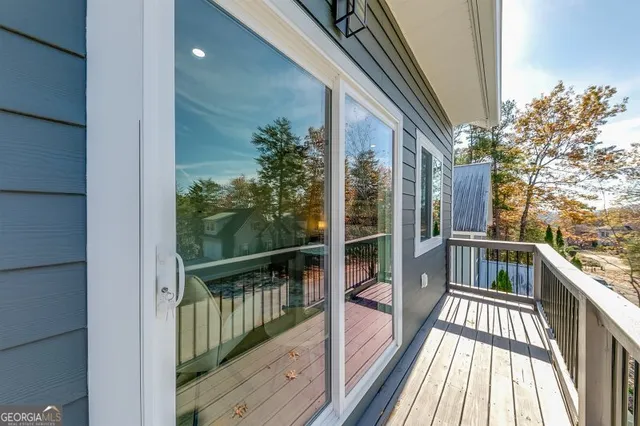 a view of a room with wooden floor and staircase