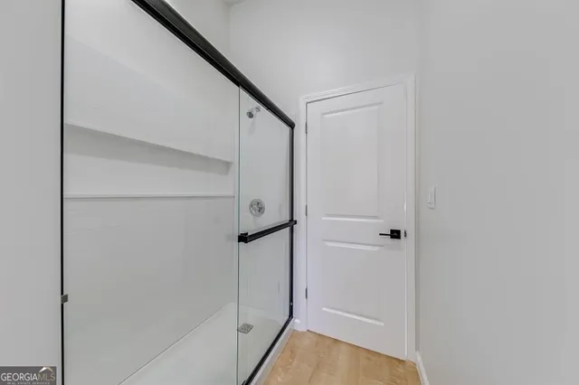 a bedroom with bed and window