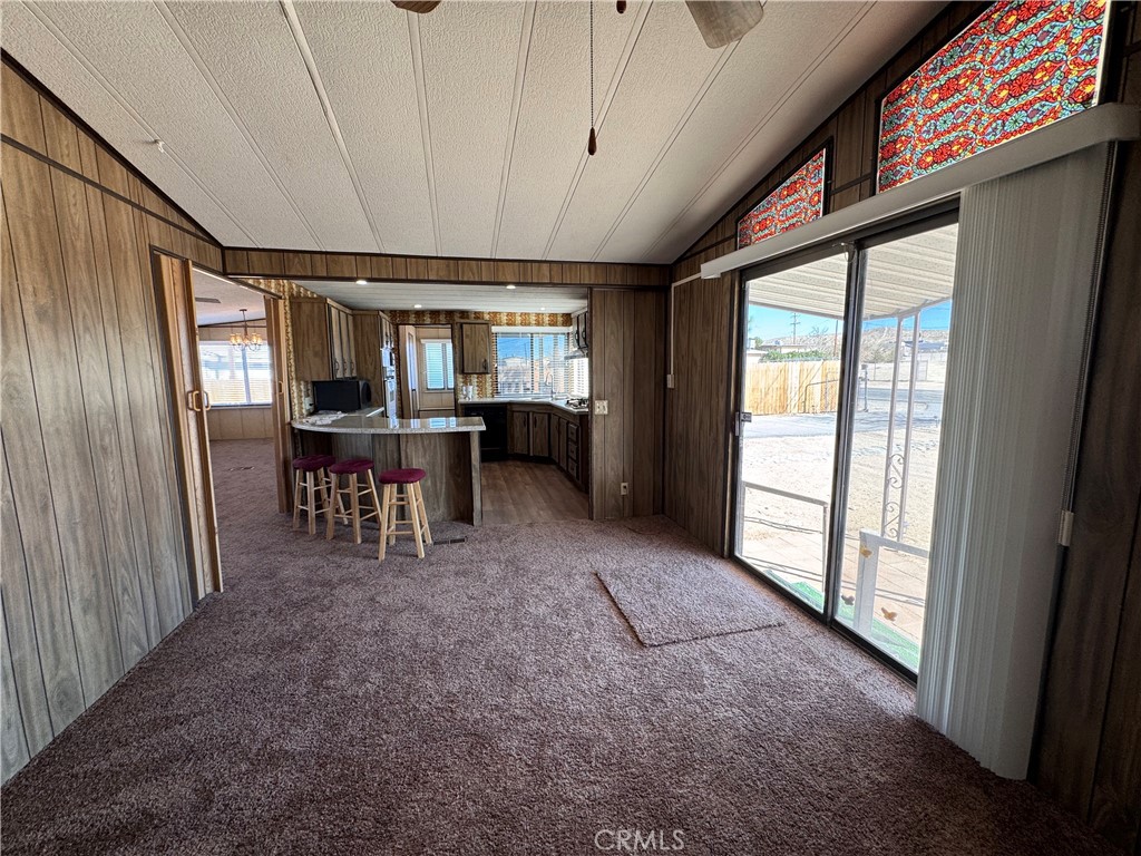 25544 Jasper Road Barstow, CA 92311 - Photo 14 of 62 a view of a dining room with furniture window and outside view