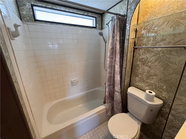 a view of a patio with table and chairs