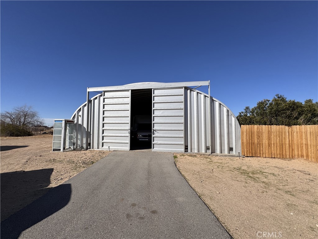 25544 Jasper Road Barstow, CA 92311 - Photo 3 of 62 a view of a house with a outdoor space