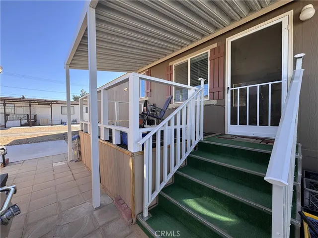a bedroom with bed and a chandelier