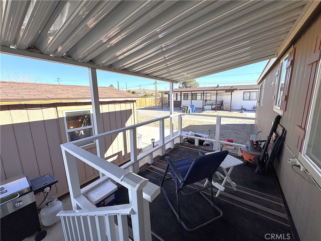 25544 Jasper Road Barstow, CA 92311 - Photo 35 of 62 a view of a patio with table and chairs