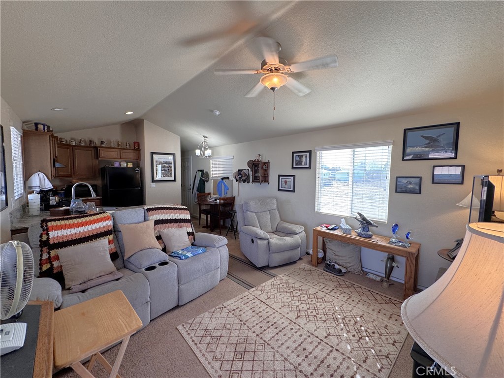 25544 Jasper Road Barstow, CA 92311 - Photo 38 of 62 a living room with furniture and a large window