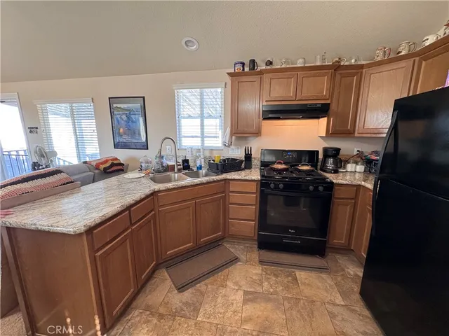 a view of a house with wooden fence
