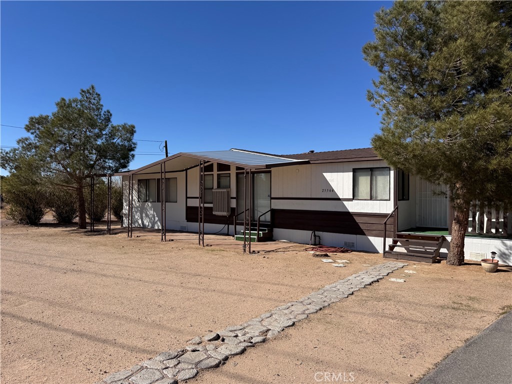 25544 Jasper Road Barstow, CA 92311 - Photo 5 of 62 a front view of house with yard