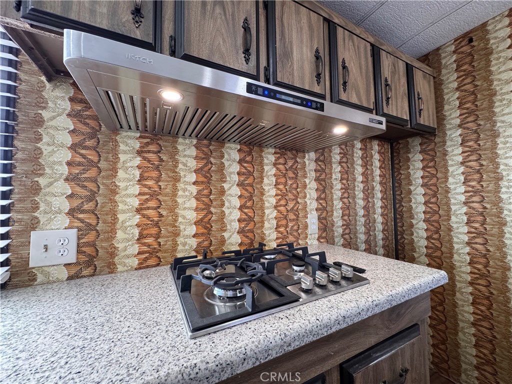 25544 Jasper Road Barstow, CA 92311 - Photo 10 of 62 a kitchen with a stove and a cabinet
