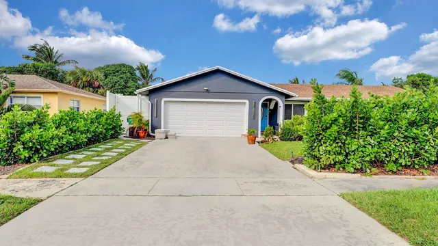 a view of garage yard and tree