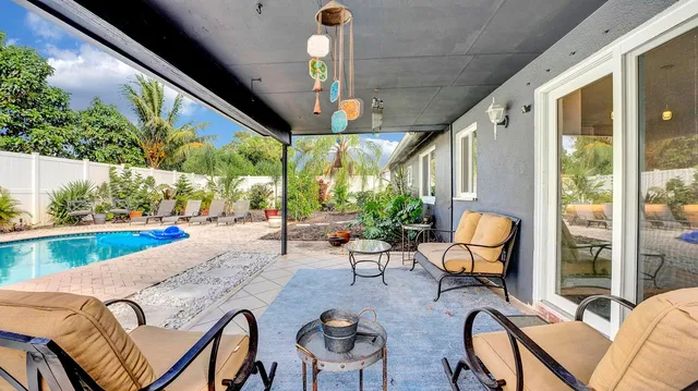 a view of a swimming pool with chairs