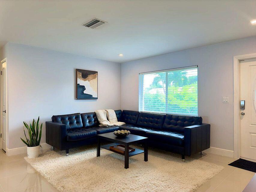 2941 Angler Drive Delray Beach, FL 33445 - Photo 26 of 34 a living room with furniture and a window