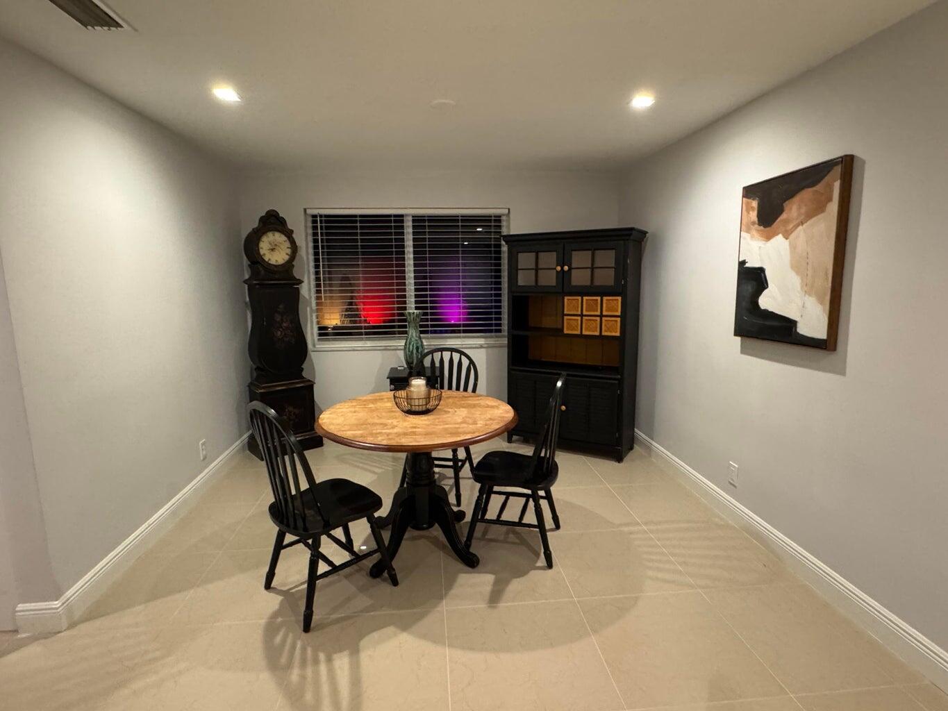 2941 Angler Drive Delray Beach, FL 33445 - Photo 27 of 34 a view of a dining room with furniture
