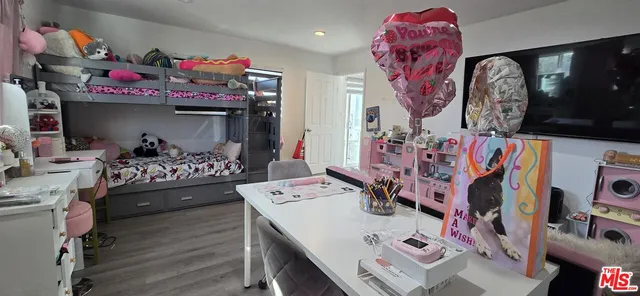 a living room with lots of furniture and wooden floor