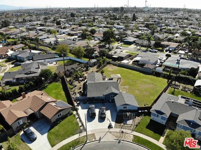 an aerial view of a house with a ocean view