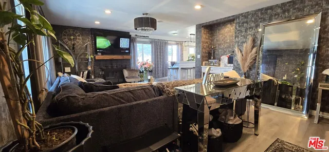 a view of a kitchen with cabinets and potted plant