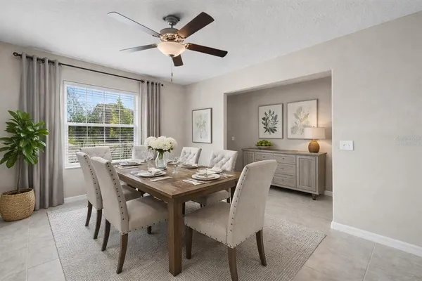 a dining room with furniture and window