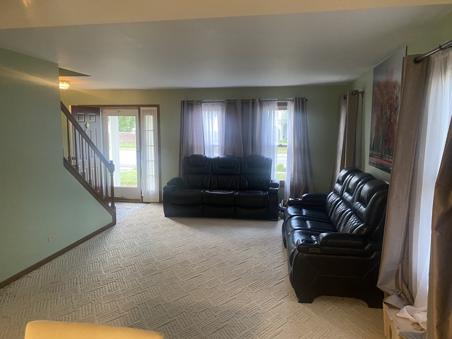 763 Cimarron Drive Cary, IL 60013 - Photo 3 of 15 a living room with furniture and a fireplace