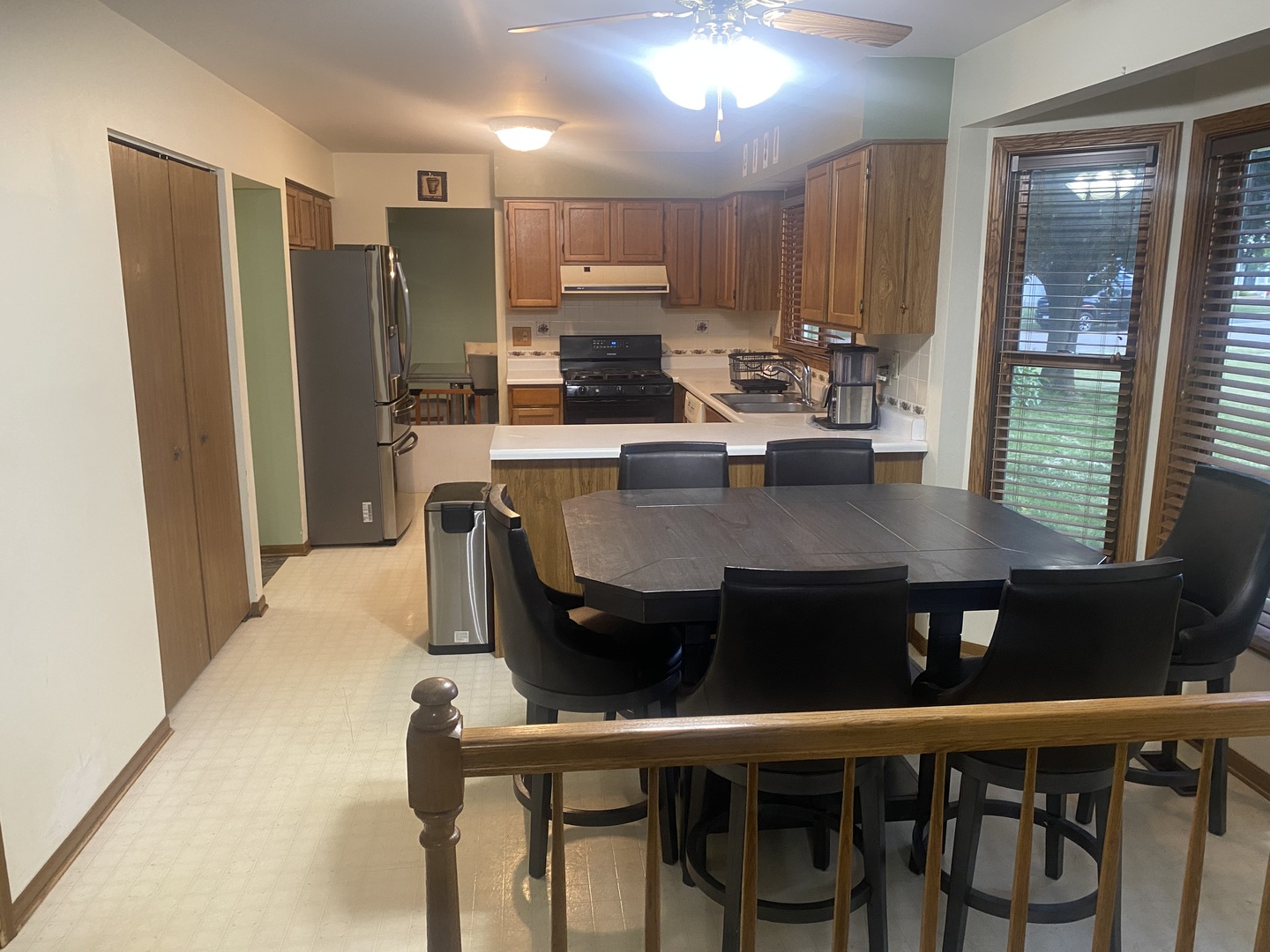763 Cimarron Drive Cary, IL 60013 - Photo 4 of 15 a kitchen with a dining table chairs and refrigerator