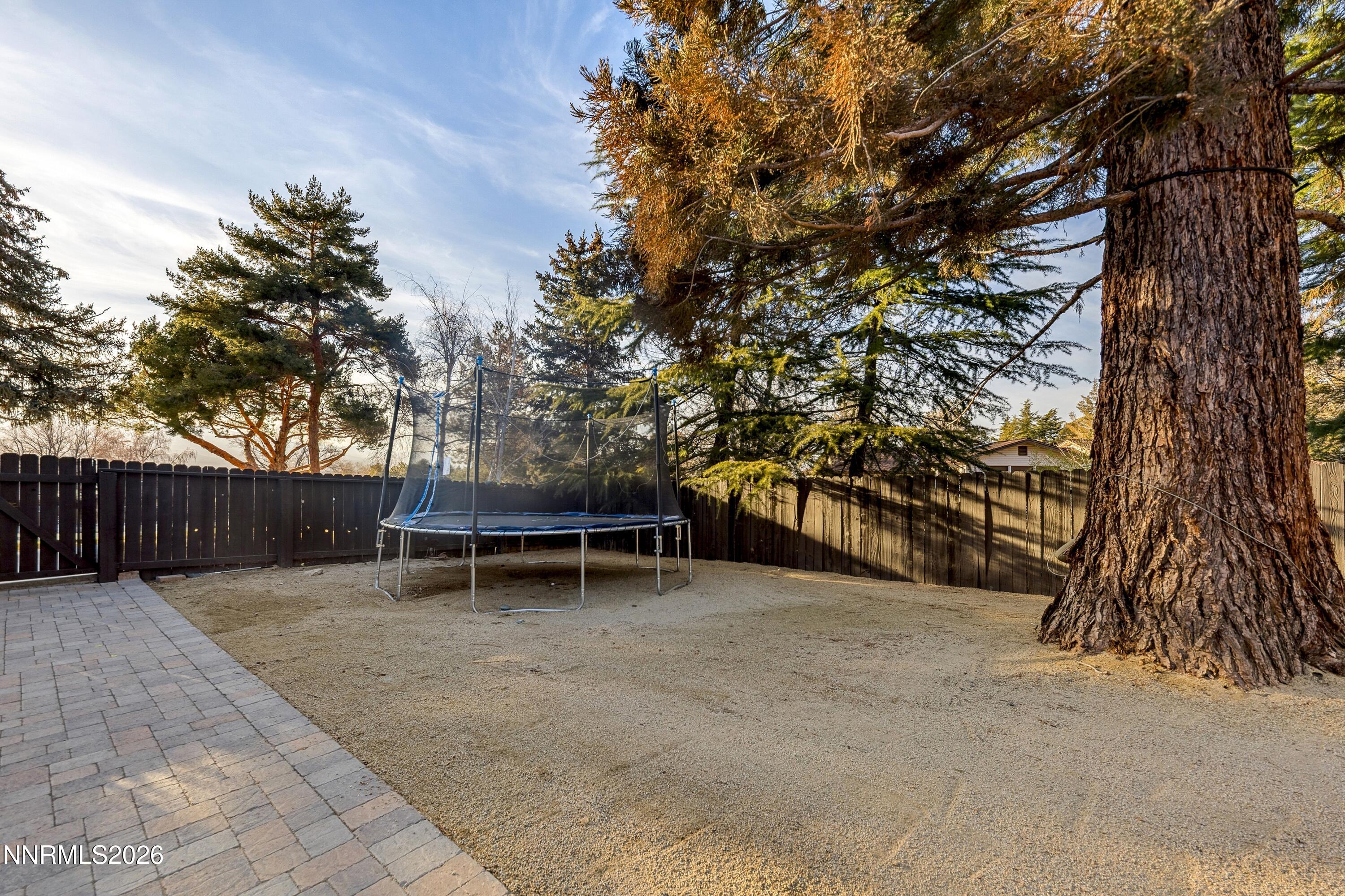 3620 East Hidden Valley Drive Reno, NV 89502 - Photo 59 of 67 a backyard of a house with table and chairs