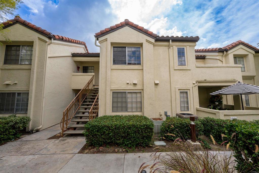 765 Eastshore Terrace, Unit 201 Chula Vista, CA 91913 - Photo 22 of 22 a front view of a house with a yard