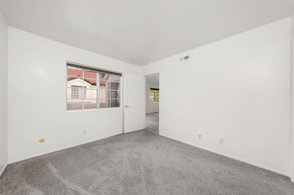 765 Eastshore Terrace, Unit 201 Chula Vista, CA 91913 - Photo 9 of 22 an empty room with windows