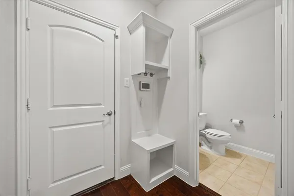 a bathroom with a shower a toilet and a sink