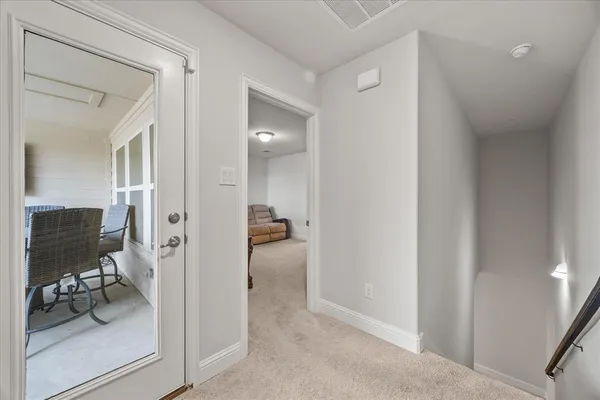 a view of a livingroom with furniture and front door