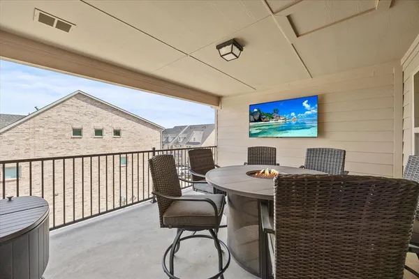 a workspace with furniture and a flat screen tv