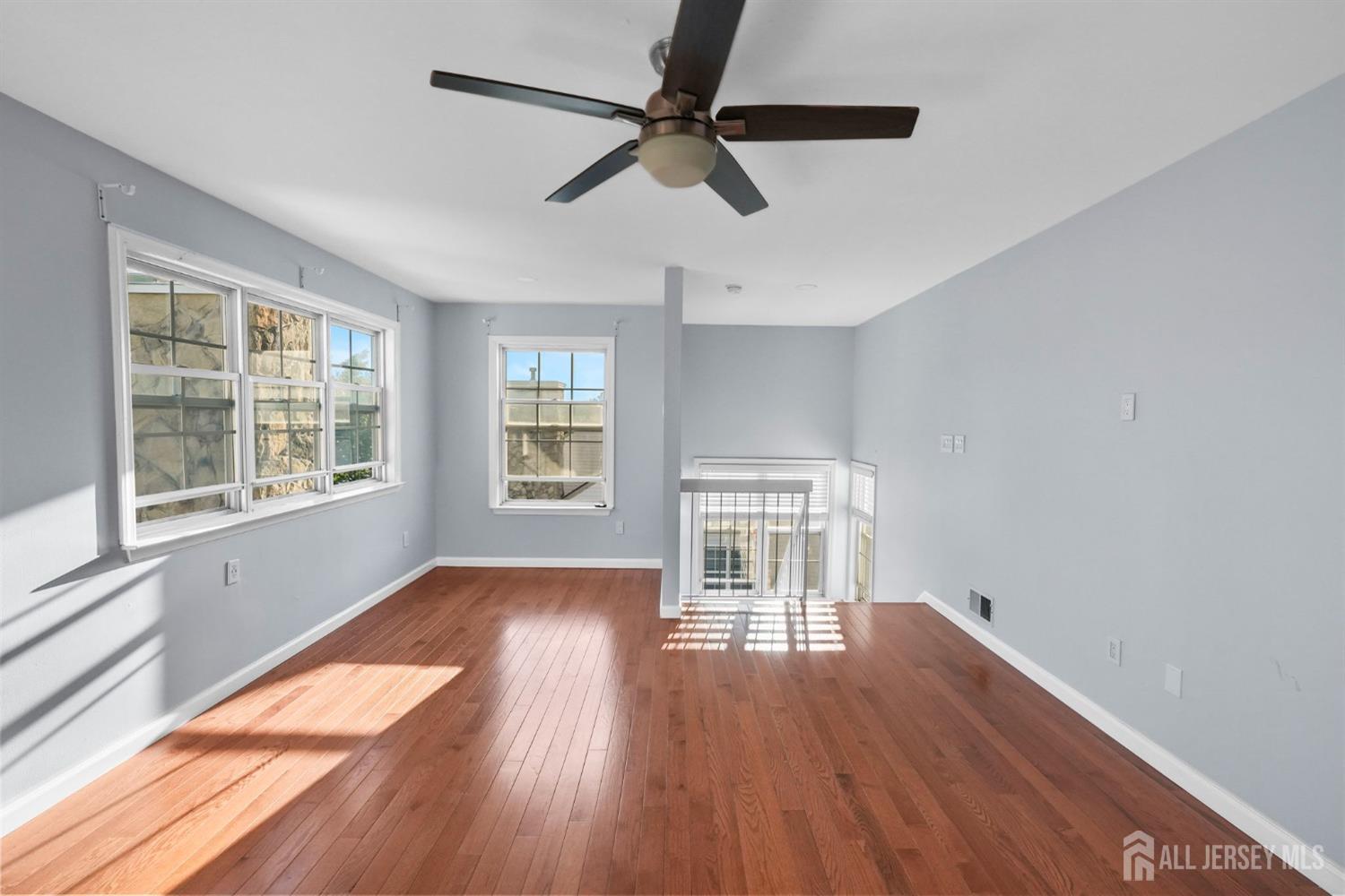 215 Nebula Road Piscataway, NJ 08854 - Photo 14 of 37 wooden floor in an empty room with a window