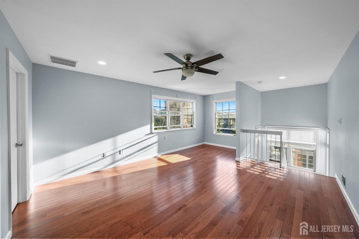 215 Nebula Road Piscataway, NJ 08854 - Photo 15 of 37 a view of empty room with wooden floor and window