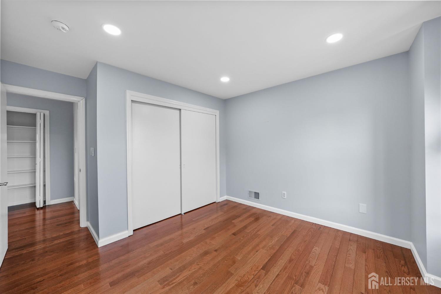215 Nebula Road Piscataway, NJ 08854 - Photo 19 of 37 a view of empty room with wooden floor