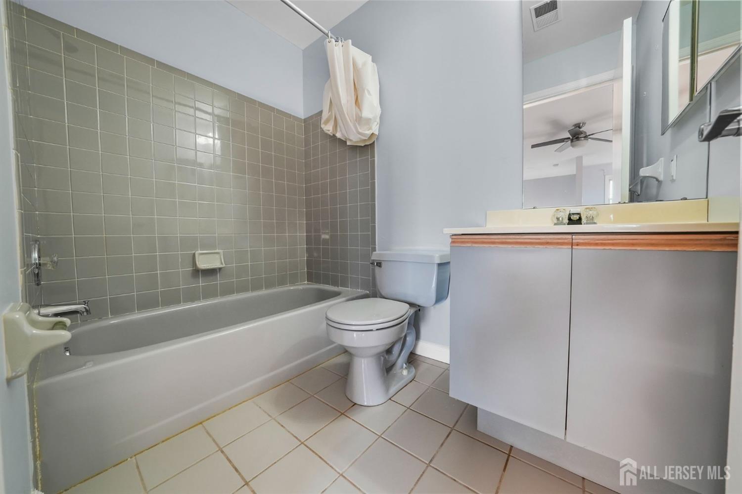 215 Nebula Road Piscataway, NJ 08854 - Photo 27 of 37 a bathroom with a toilet a sink and bathtub