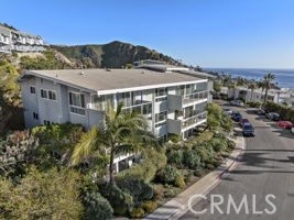 21703 Ocean Vista Drive, Unit 102 Laguna Beach, CA 92651 - Photo 19 of 19 a front view of a house with a garden