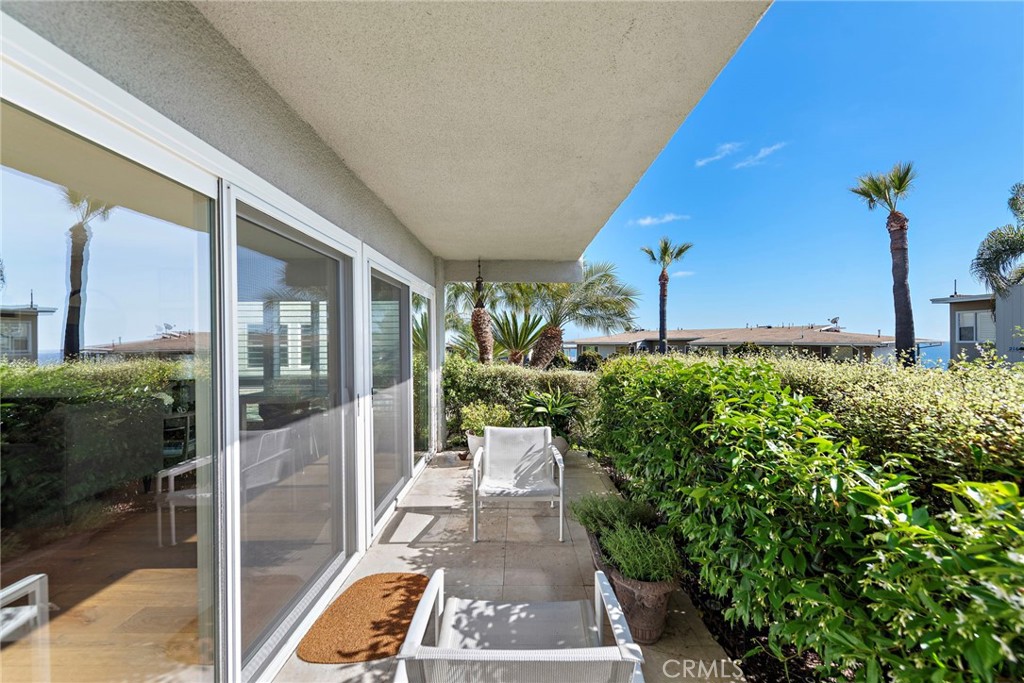 21703 Ocean Vista Drive, Unit 102 Laguna Beach, CA 92651 - Photo 6 of 19 a view of a building with a garden