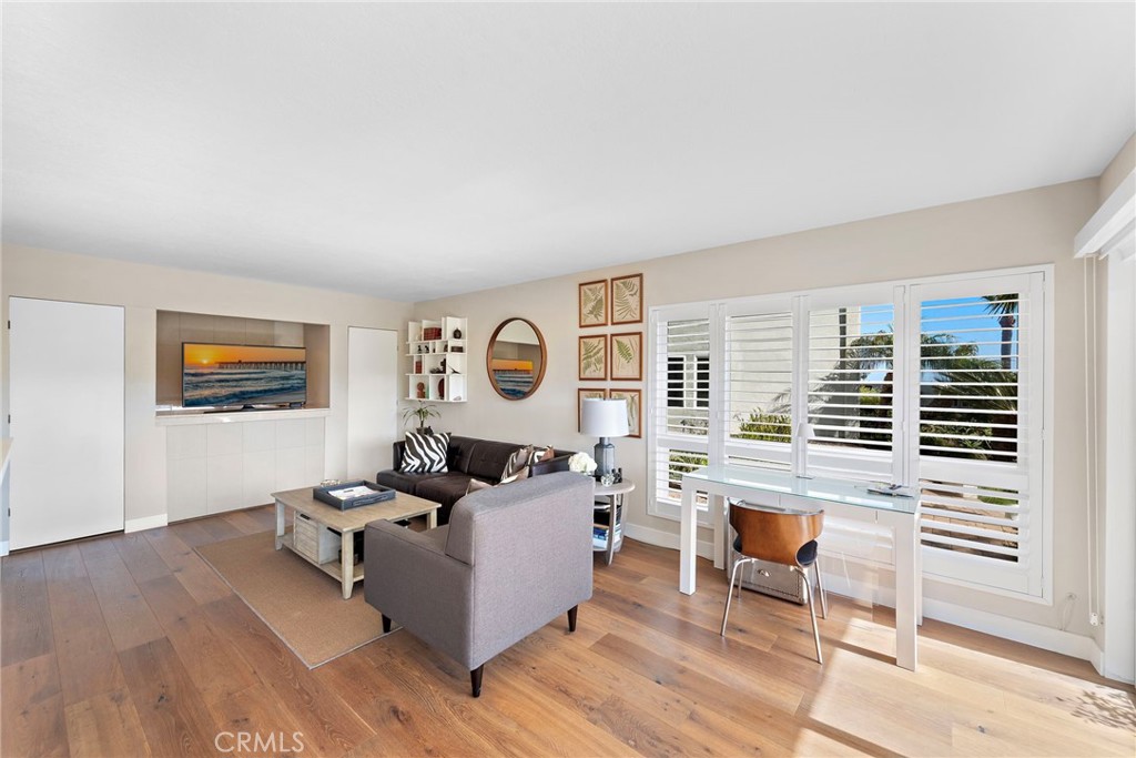 21703 Ocean Vista Drive, Unit 102 Laguna Beach, CA 92651 - Photo 9 of 19 a living room with furniture and a window
