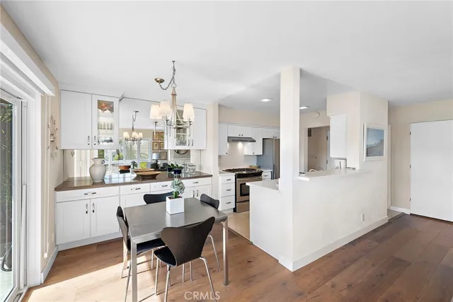 a kitchen with stainless steel appliances kitchen island granite countertop a sink and cabinets