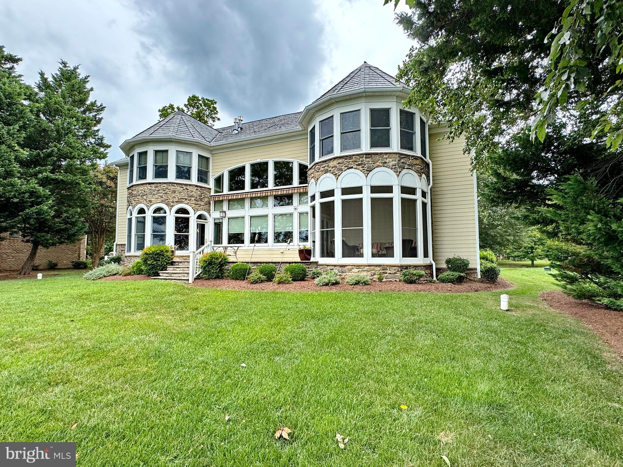 11660 Bachelors Hope Court Issue, MD 20645 - Photo 12 of 82 a front view of a house with a yard