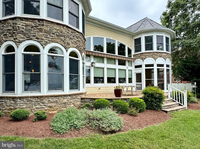 a view of a swimming pool and trees in the background