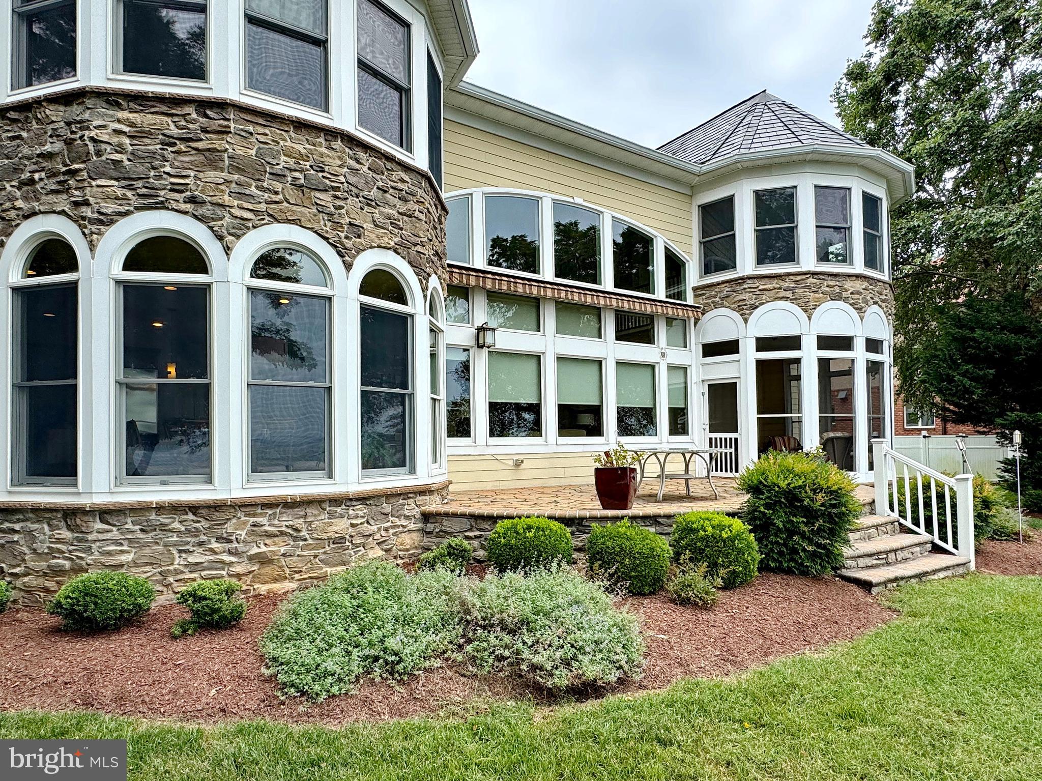 11660 Bachelors Hope Court Issue, MD 20645 - Photo 14 of 82 a front view of a house with a yard
