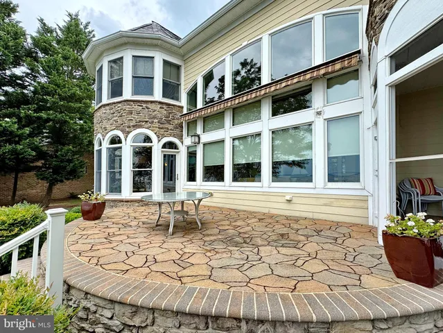 a bedroom with bed and a chandelier