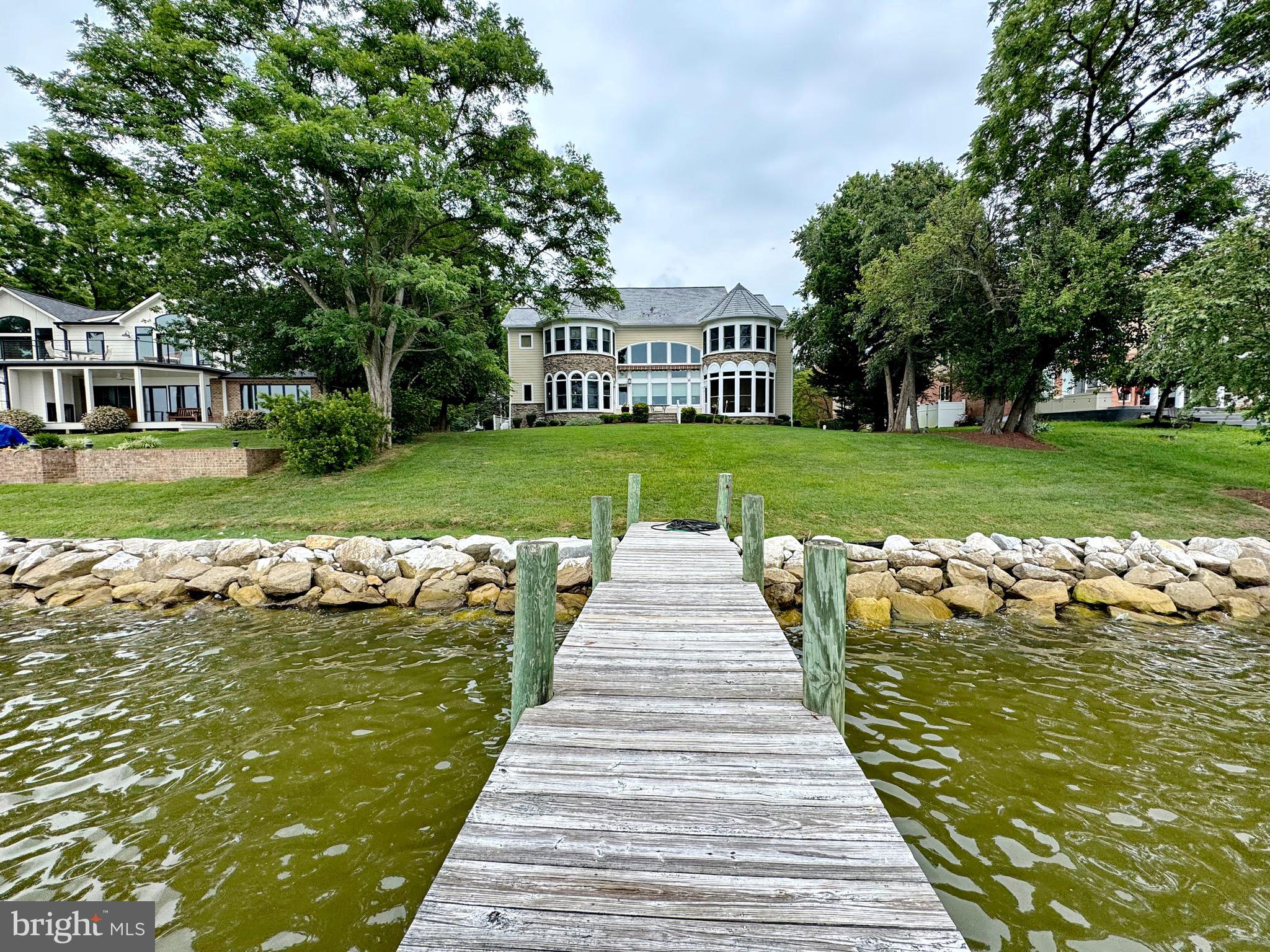 11660 Bachelors Hope Court Issue, MD 20645 - Photo 17 of 82 a view of a swimming pool and trees in the background
