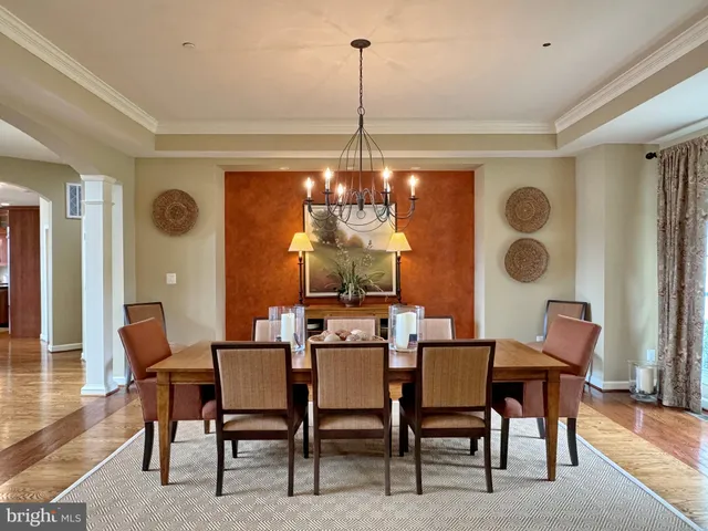 a kitchen with a large window and a clock on the wall